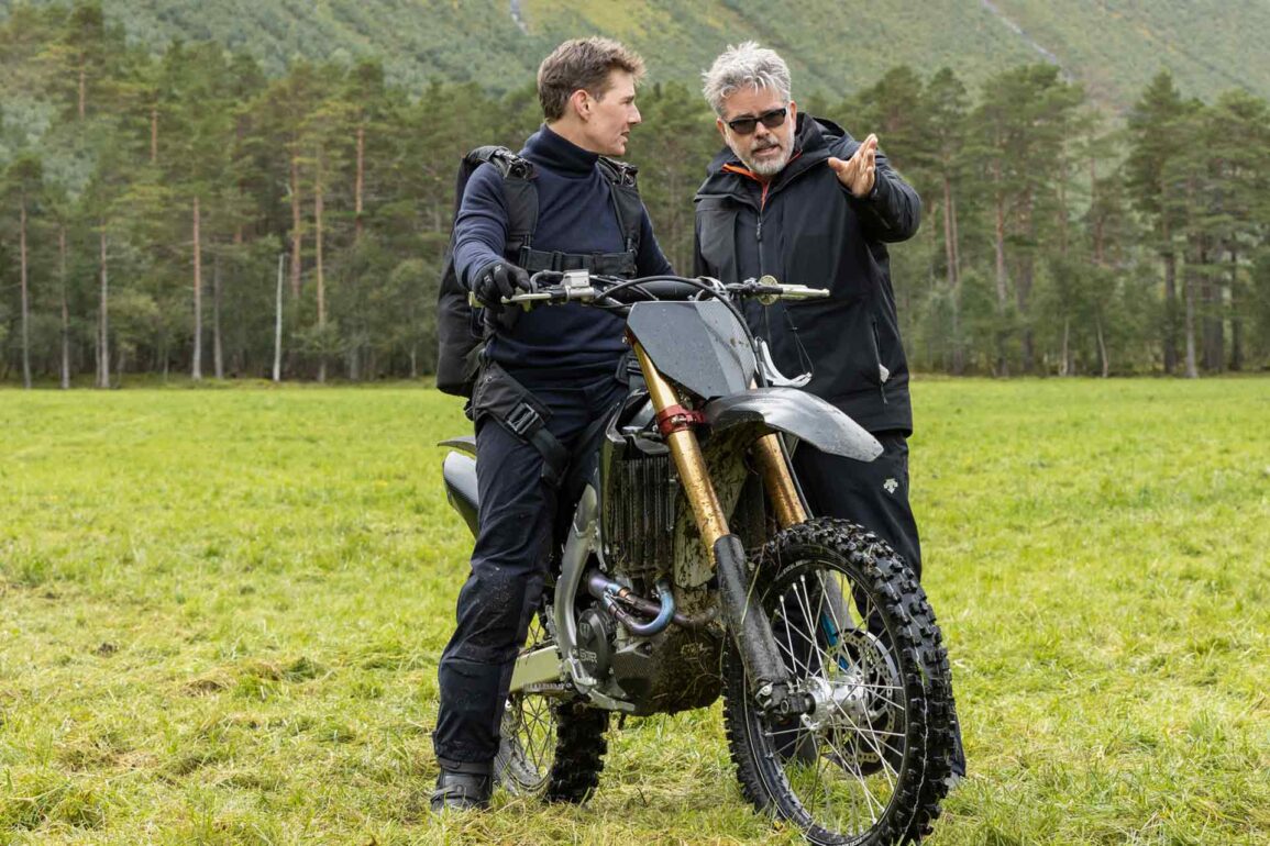 Christopher McQuarrie directs Tom Cruise for the famous bike stunt on the set of Mission: Impossible - Dead Reckoning Part One