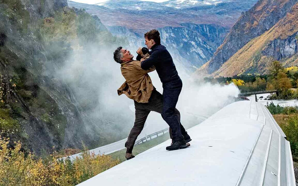 Tom Cruise and Esai Morales fight on the rooftop of a running train in a still from Mission: Impossible - Dead Reckoning Part One