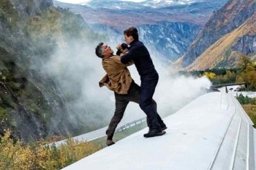 Tom Cruise and Esai Morales fight on the rooftop of a running train in a still from Mission: Impossible - Dead Reckoning Part One