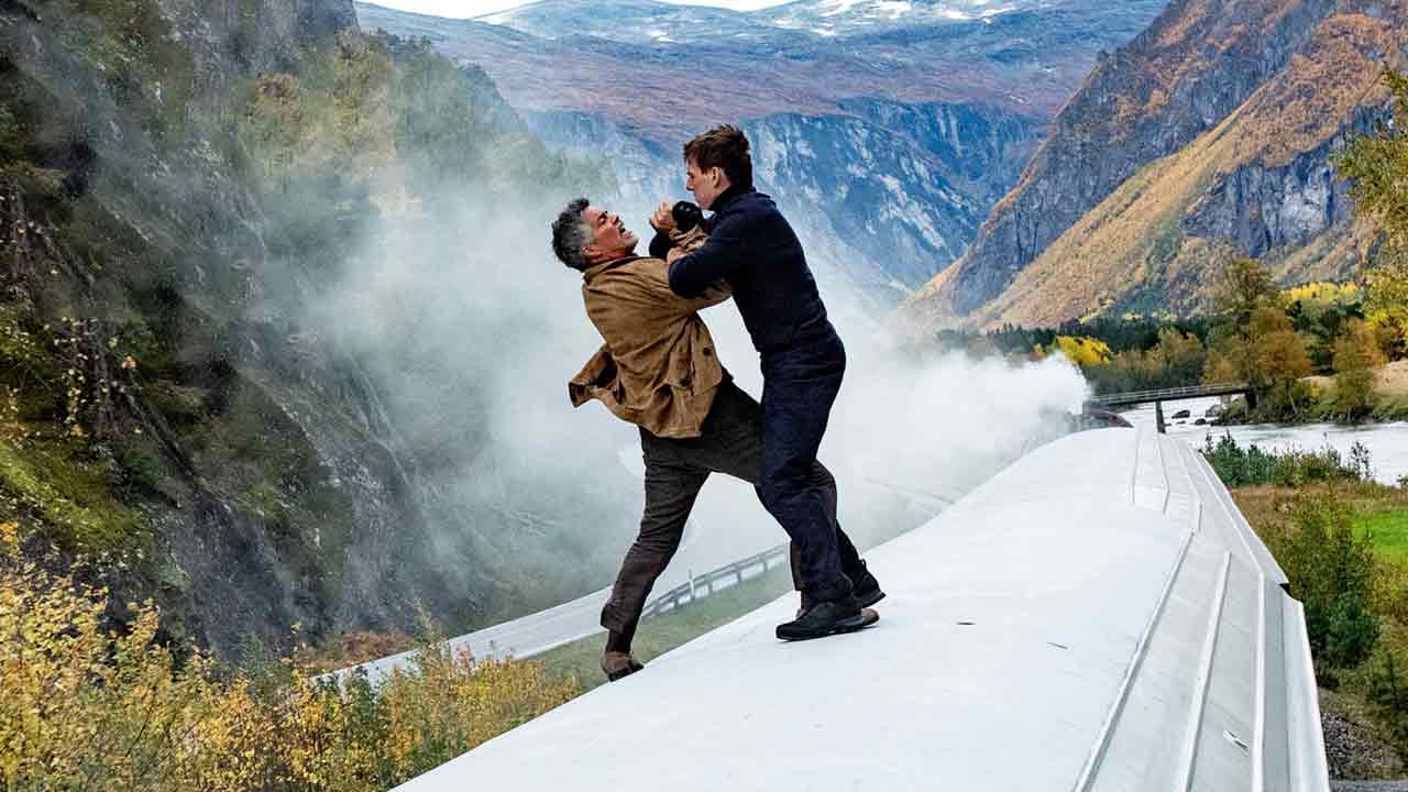 Tom Cruise and Esai Morales fight on the rooftop of a running train in a still from Mission: Impossible - Dead Reckoning Part One